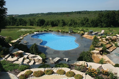 Vinyl-liner pool blends with natural surroundings