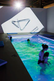 photo of people as part of a swimming pool art exhibit