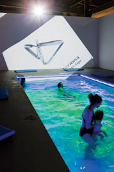 photo of people as part of a swimming pool art exhibit