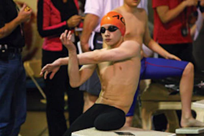 photo of Caleb Utesch preparing to swim