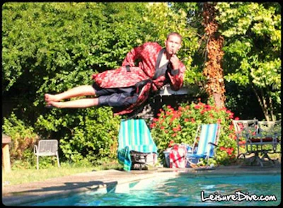 photo of guy with a pipe diving sideways into pool