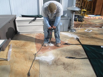 photo of Tripp Construction employee working on custom pool cover job