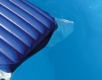 photo of flotation air mattress in a pool
