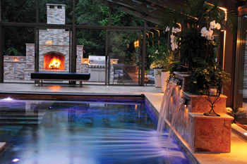 Photo Of Four Part, Backlit Water Feature Produces A Beautiful Sunburst Effect In The Pool
