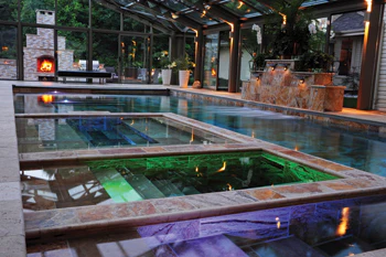 photo of pool with inset spa and chill pool