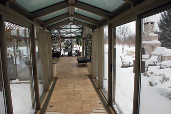 photo of glassed in corridor to the pool room