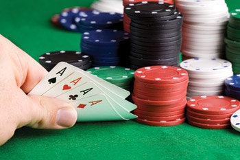 photo of 4 Aces in a hand of cards