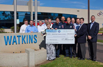 photo of Watkins charity auction check