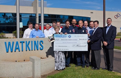 photo of Watkins charity auction check