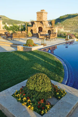 photo of outdoor fireplace with hillside views