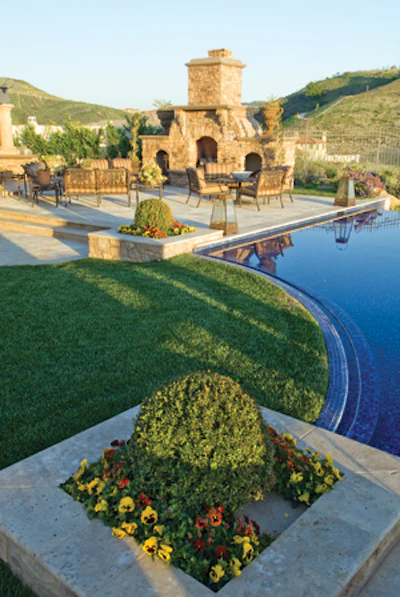 photo of outdoor fireplace with hillside views
