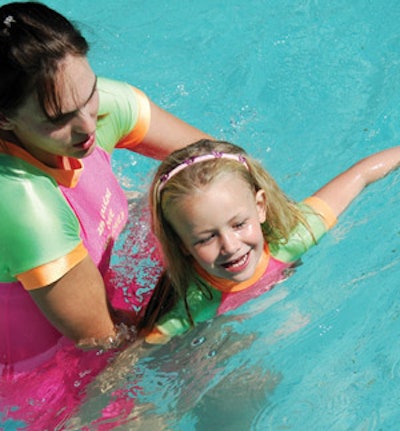 photo of girl getting swimming lessons