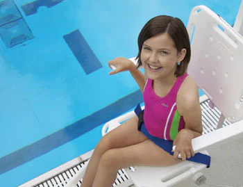 photo of girl using access equipment to enter a pool