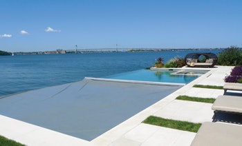 image of automatic cover closing on vanishing edge pool by Paco Pools and Spas