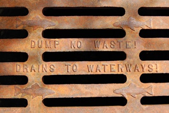 photo of drain cover that says Dump No Waste! Drains to Waterways
