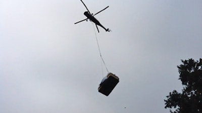 photo of helicopter carrying a swim spa