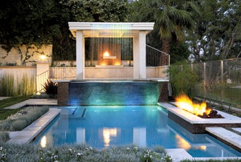 Fire elements have grown in popularity in recent years, both as gathering places and as purely aesthetic elements that lend drama, warmth and interest to today’s backyard resort settings. (Credit: www.OutdoorFireplaceDesignIdeas.com)