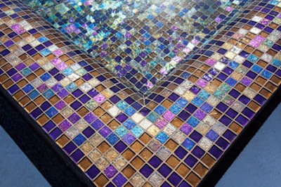 The custom glass tile blend was created by David Knox of Lightstreams Glass Tile.