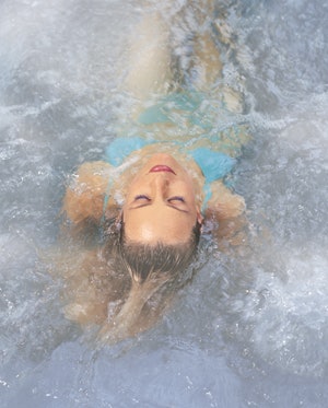 woman soaking in spa