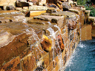 photo of pool using waterfall and stone work