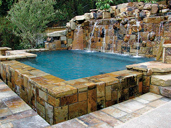 photo of pool using waterfall and stone work