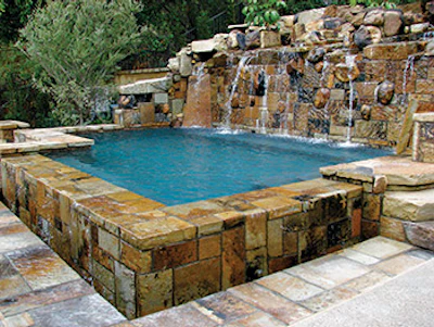 photo of pool using waterfall and stone work