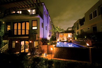 photo of pool with fire features and lighting