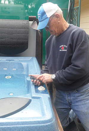 photo of pool service technician using new software