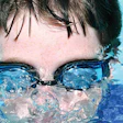 photo of boy with swimming goggles