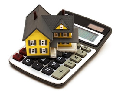 photo of a model home on a calculator