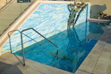 Not only does this pool feature an all-tile bottom, but the tile extends up the adjoining wall for a powerful effect. (Photos courtesy of Agape Tile.)