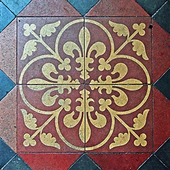 photo of a tile with the fleur-de-lis pattern