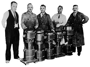 Five of the Jacuzzi brothers gather around a series of industrial injector pumps