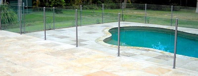 photo of a pool with a glass fence