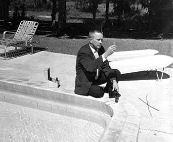 photo of a man testing pool water in 1961