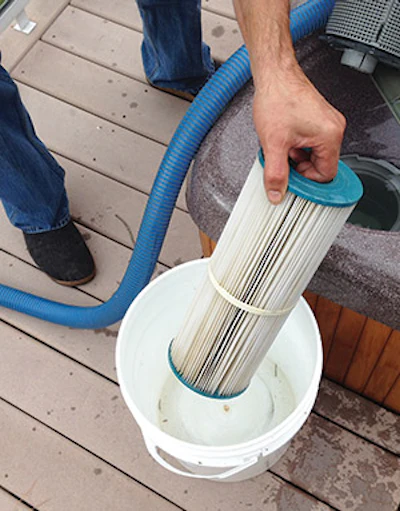 Put the old, wet filter in the 5-gallon pail you brought (of course you brought one) so it doesn’t drain out on the deck and create a slipping hazard.