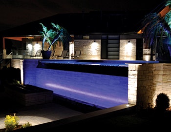 photo of an infinity edge pool at night
