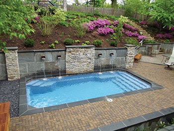 This project includes a number of elements typically associated with custom concrete pools.