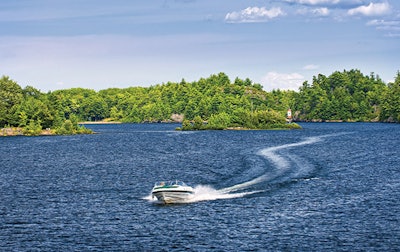 photo of a speed boat out on a lake