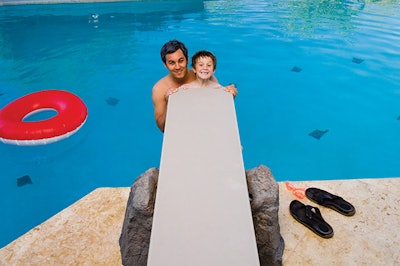 photo of a man and a boy at a diving board