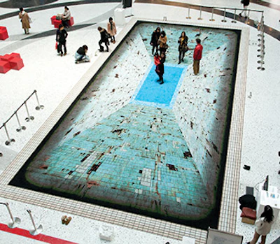 photo of people on a pool illusion carpet