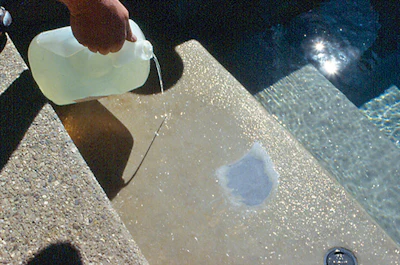 photo of a man sanding crystal formed in a swimming pool