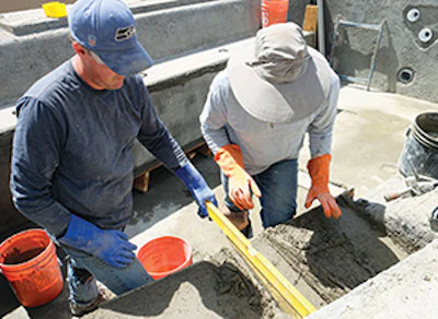photo of glass pool tile installation
