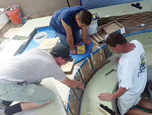 photo of glass pool tile installation