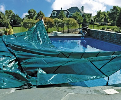 Photo Of A Coverlogix Pool Cover Being Put Into Place