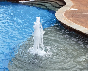 photo of a pool fountain feature
