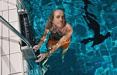 photo of a man in a pool with Ben Franklin's head
