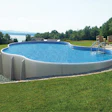 Photo of an aboveground pool in a sloped backyard. All photos courtesy of Radiant Pools