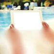 photo of someone looking at a tablet