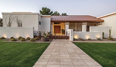 The entry to the home introduces a number of design elements echoed throughout the home, including the soft color palette, travertine paving, modular design and the use of art as inspiration.